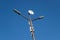 Lamppost with antenna mounted on it. Pillar against the blue sky