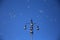 Lamppost with the clear blue sky in the background, surrounded by soap bubbles