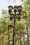 A lamppost decorated with flower pots is on the territory of the Dadiani Palace - the residence of an ancient family of Megrelian