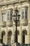 Lamppost in foreground with old historic restored buildings of Old Havana, Cuba