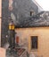 Lamppost and house facade with window and inferiata