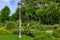 Lamppost in retro style with a lantern in the garden.