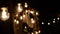 Lamps close up. Wedding garlands that glow on the arch. Vespers Wedding Ceremony