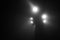 Lamps on a high rail mast at train Station in Chomutov city in dark foggy night