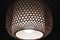 Lamps with wicker shades, cozy lighting. Geometric pattern