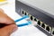 LAN network switch with ethernet cables plugging in