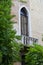 Lancet window with shutters and balcony