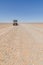 Land Cruiser 4x4 on empty rocky desert road to Erg Chebbi in the Moroccan Sahara, Africa