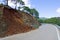 Land or mudslide on mountain road after storm