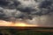 Landcape with storm clounds at sunset