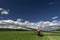 A landed glider on the grass air field ground