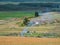 Landfill garbage fire inferno in mountain steppe with heavy smoke