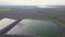 Landfill for solid waste of a thermal power plant. Aerial video of a crowded ash dump. Ash, slag, waste, landfill.