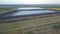 Landfill for solid waste of a thermal power plant. Aerial video of a crowded ash dump. Ash, slag, waste, landfill.