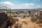 a landfill surrounded by a fence to discourage illegal dumping