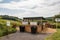 landfill surrounded by greenery, with recycling bins and educational signage for added convenience