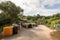 landfill surrounded by greenery, with recycling bins and educational signage for added convenience