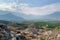 landfill surrounded by natural landscape, with mountains in the background