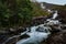 Landfoss Waterfall 2000 ft tall cascade flowing into Akrafjorden