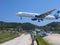 Landing of airplane on Skiathos over heads of people