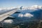 Landing in the city of Vancouver. Aerial view.  Buildings, houses, river. Sunny day and cloudy sky.