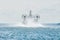 Landing Craft Air Cushion hovercraft flying above water, air cushion sailing splashing sea water