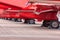 Landing gear of Royal Air Force RAF Red Arrows display team British Aerospace Hawk T.1 Jet trainer aircraft parked in a line.