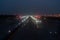 Landing lights ON A airport runway at night sky.