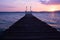 Landing stage with bathing ladder at sunset