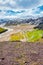 Landmannalaugar, Iceland. Bird view at camping site and mountain hut with many tents and cars, Icelandic landscape of colorful