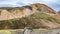 Landmannalaugar, Iceland. Panoramic over most colorful Brennisteinsalda Mount volcano and hikers. Icelandic landscape of colorful