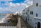 Landmark of Asilah - Atlantic Ocean Surf and Old City Wall with white houses on Seaside. Asilah, Morocco