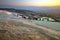 Landmark attraction - Sunset landscape with famous terraces of Pamukkale, Turkey