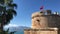 Landmark old fortress Hidirlik Tower Antalya Turkey Turkish flag waving