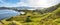 Landmark panoramic view of `Gili Lawa` with green savanna grass and blue sea in an evening, Komodo Island, Labuan Baj