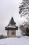 Landmark Uhrturm on hill Schlossberg in Graz on snowy winterday
