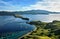 Landmark view of `Gili Lawa` with green savanna grass and blue sea in an evening, Komodo Island Komodo National Park, Labuan Baj