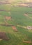 Lands aerial view. Mosaic golden fields and green meadows
