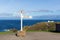 Lands End Cornwall England UK signpost blue sea and sky