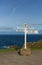 Lands End Cornwall England UK signpost blue sea and sky