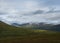 Landscap of Lapland nature at Kungsleden hiking trail with colorful mountains, rocks, autumn colored bushes, birch tree and heath