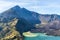 Landscape of active volcano Baru Jari, Lake Segara Anak and summit of Rinjani mountain. Lombok island, Indonesia