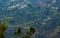 Landscape aerial view of terrace type crop field with few houses on mountain, agriculture concept