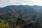 Landscape aerial view of terrace type crop fields on mounatins and cloudy sky in the background