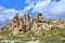Landscape with an ancient cave settlement in the mountains of Cappadocia, in spring