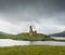 Landscape with ancient ruins of the small castle of Ardvreck in Scotland.