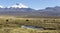 Landscape of the Andes Mountains, with llamas grazing.