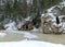 Landscape with Anfabrikas rock Ligatne, artificial caves in the rock wall, all covered with snow, Ligatne, Latvia