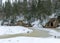 Landscape with Anfabrikas rock Ligatne, artificial caves in the rock wall, all covered with snow, Ligatne, Latvia