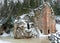 Landscape with Anfabrikas rock Ligatne, artificial caves in the rock wall, all covered with snow, Ligatne, Latvia